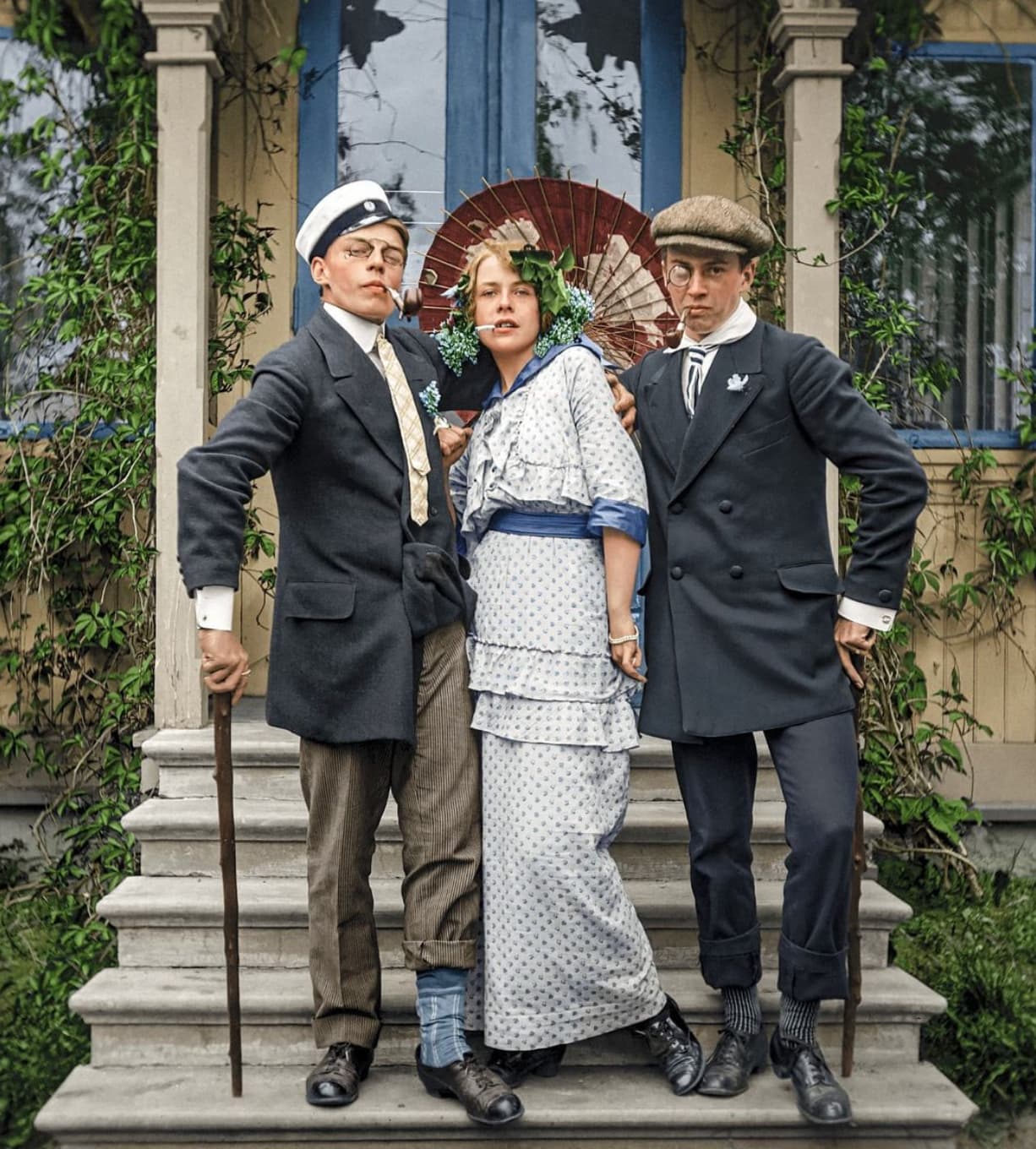 “Three people playfully posing for a photograph in front of Villa Solhem in Helsinki, Finland in 1917.”